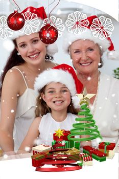 Daughter mother and grandmother baking Christmas sweets against snow falli