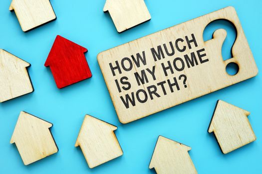 How Much is My Home Worth sign and red house model.