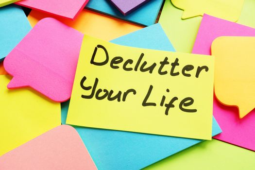Declutter your life written by hand on the sheet.