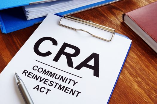 Community Reinvestment Act CRA in the blue clipboard.