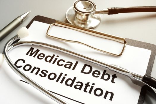 Medical debt consolidation form and stethoscope.
