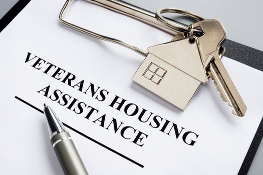 Veterans housing assistance documents and key from home.