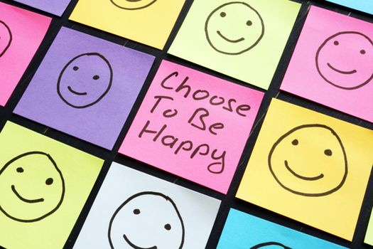 Choose To Be Happy motivation sign on the sheet.