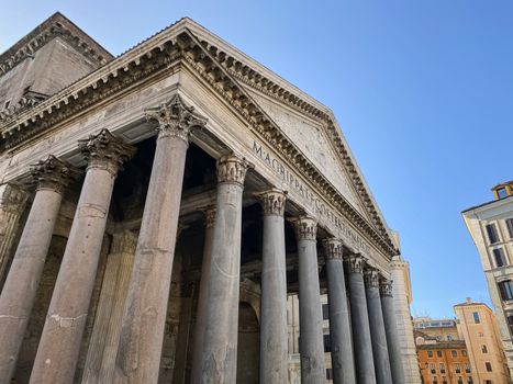 Wide angle shot of the facade with columns of the Pantheon in Rome. Travel destination and famous place. Roman Empire and architecture