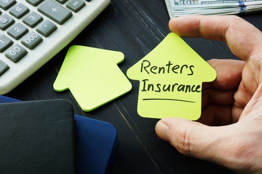 Renters insurance sign on the house shaped sheet.