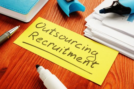 Outsourcing recruitment memo sign about HR process of delegation.