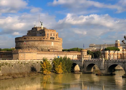 The mausoleum of Hadrian, known as Castel Sant'Angelo, with the bridge over the Tiber river on a sunny day in Rome. Famous place and tourist destination. Travel and Roman monuments