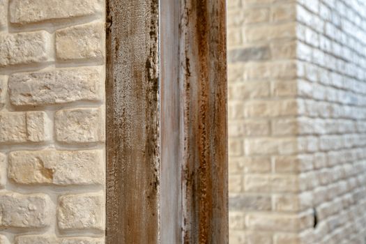 A fragment of the wall lined with white brick. Brick background.