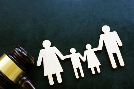 Family law and custody concept. Family shape and gavel.