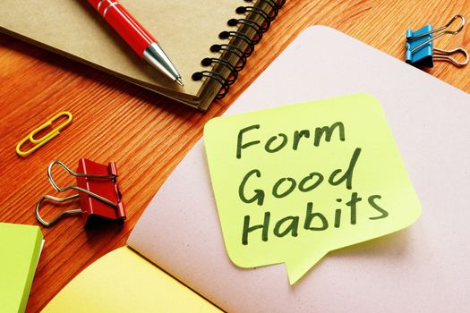 Form good habits motivational phrase on the yellow sheet.