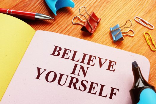 Believe in yourself motivational quote on the sheet.