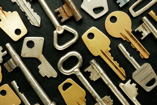 Closeup of different old metal keys background.