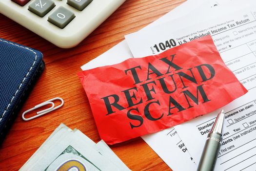 Tax refund scam red sheet about fraud and money.