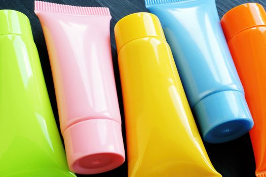 Multi-colored tubes with cosmetic cream.