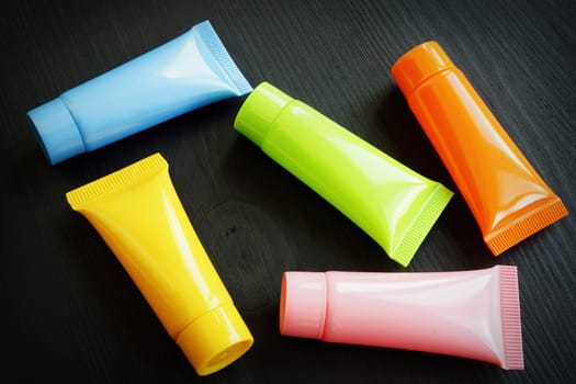 Cosmetic products in the form of a set of different tubes.