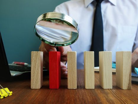 Searching talent or employee concept. Recruiter holds magnifying glass.