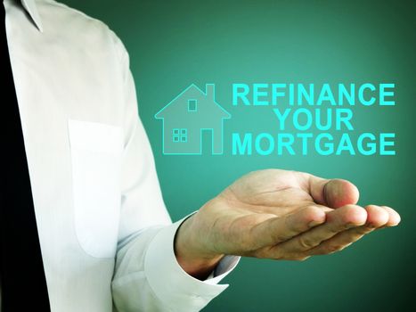 Hand with iscription refinance your mortgage.