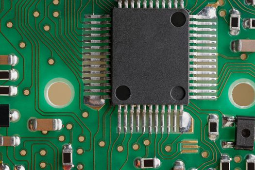 PCB board supermacro close-up. Many capacitors, resistors on board. Digital engineering photo. Flash microprocessor on photo. 