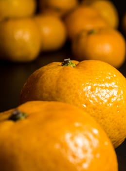 Close-up on glossy surface of freshness orange fruits