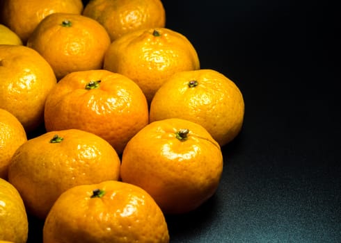 Close-up on glossy surface of freshness orange fruits