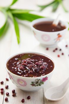 A bowl of homemade red bean soup with a spoon