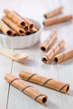 Chocolate wafer roll on wooden table