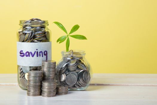 Jar for savings full of coins.