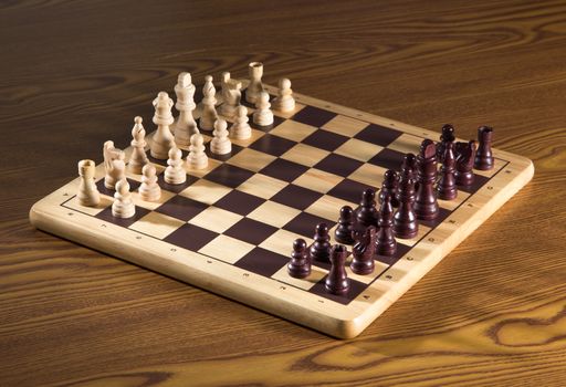 Chess board with chess wooden pieces