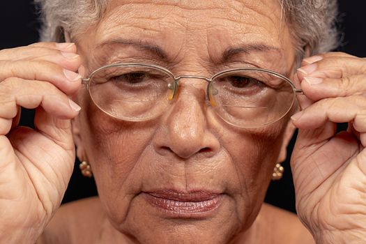 Old wrinkled woman wearing glasses