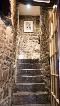 Stone Stairs in in a french traditional medieval house, Mont Saint michel, France 9-9-19