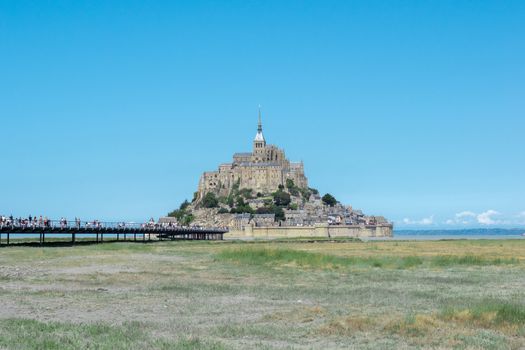 Beautiful View of Mont Saint michel peninsula in France 9-9-19. Blue sky and green grass around