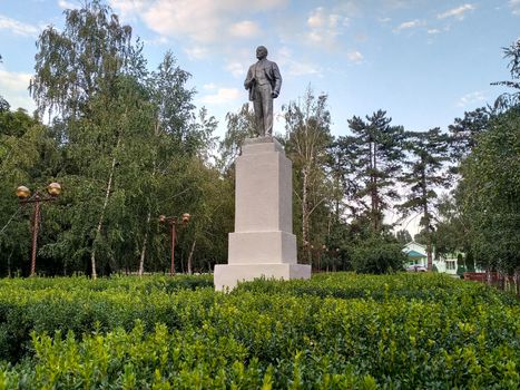 Monument to Lenin on a pedestal in the park. Leader of communism