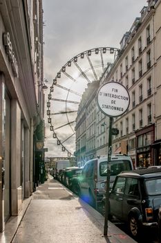 "Roue de la Concorde", Wheel of Concorde square in french, with "no parking" sign in front of it, view from " Rue saint Honoré "