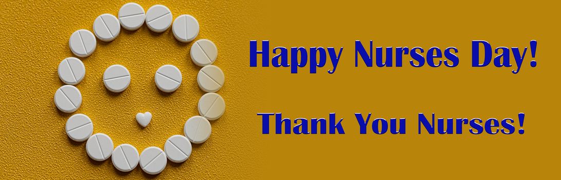 White tablets are arranged in the form of a smiley face on a yellow background. Text of congratulations on the medical holiday nurse's Day. Healthcare and medical concept