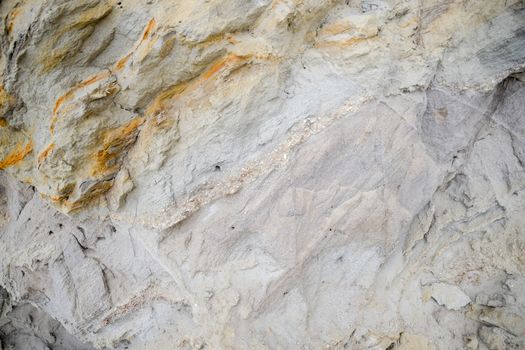 The sedimentary layers of the rock in the sand scree. sand, pebbles and shells in sedimentary rocks.