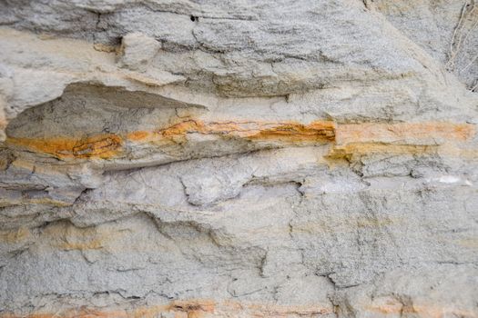 The sedimentary layers of the rock in the sand scree. sand, pebbles and shells in sedimentary rocks.