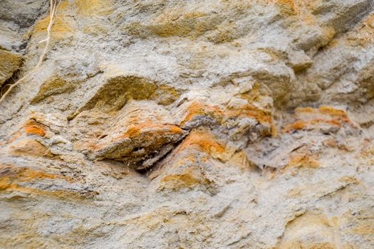 The sedimentary layers of the rock in the sand scree. sand, pebbles and shells in sedimentary rocks.