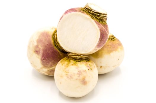Freshly harvested spring turnips (Brassica rapa) on white background
