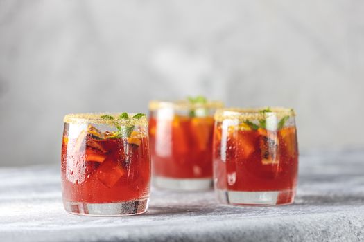 Three glasses of campari gin spritz. Cocktail of sweet, a touch of bitter from the campari and gorgeous fizz from the champagne topper.