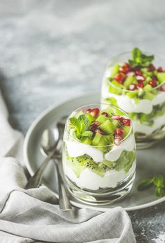 Healthy meal made of granola, yogurt and kiwi fruits. Delicious food for breakfast. Traditional American snack.