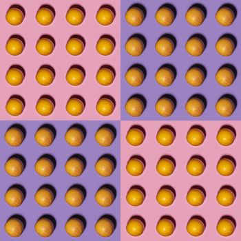 Orange pattern on pink and violet background. Creative food concept. Flat lay.