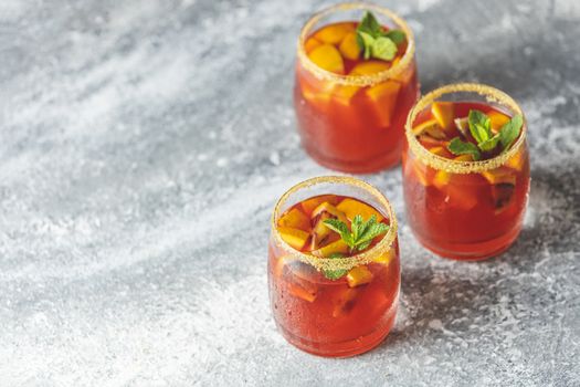 Three glasses of campari gin spritz. Cocktail of sweet, a touch of bitter from the campari and gorgeous fizz from the champagne topper. Copy space for you text.