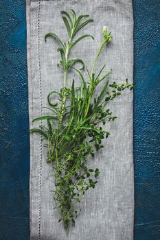 Herbs and spices.Fresh herbs selection included rosemary, thyme, mint, lemon balm and arugula. Overhead view, copy space.