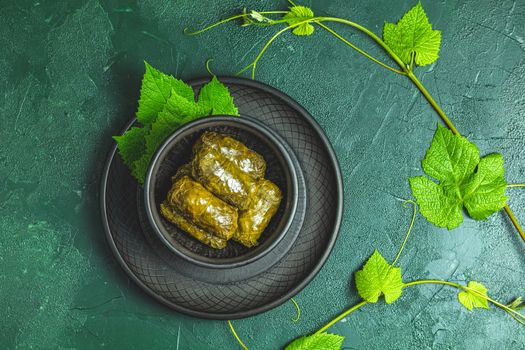 Traditional Middle Eastern dolma or tolma or sarma. Latin American Mexican Chilean cuisine ninos envueltos. Grape leaves stuffed with meat and rice. Lebanon turkish greek middle eastern cuisine.
