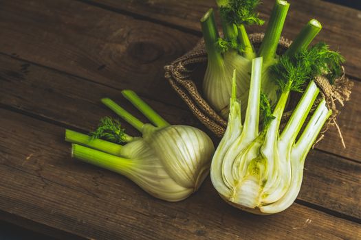 Fresh Florence fennel bulbs or Fennel bulb on wooden background. Healthy and benefits of Florence fennel bulbs