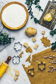 Culinary Spring or Christmas food background. Ingredients for ginger cookies. Dough for baking. View from above.