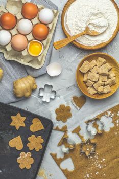Culinary Spring or Christmas food background. Ingredients for ginger cookies. Dough for baking. View from above.
