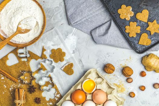 Culinary Spring or Christmas food background. Ingredients for ginger cookies. Dough for baking, brown sugar, flour, eggs. View from above.