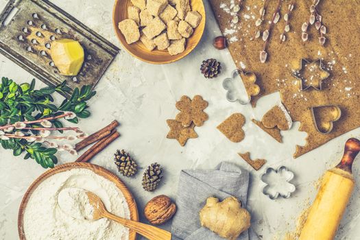 Culinary Spring or Christmas food background. Ingredients for ginger cookies. Dough for baking, brown sugar, flour, eggs. View from above.