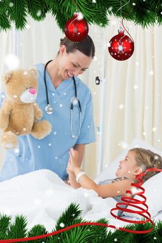 Playful doctor entertaining sick girl against snow falling